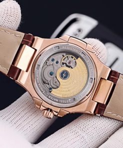 TheChronoLux - Patek Philippe Nautilus Annual Calendar 42mm Gold & White, 13327427057428074